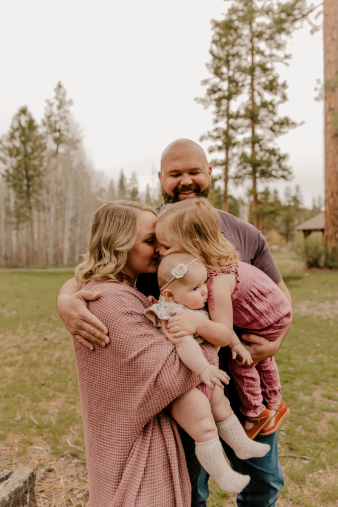 family photography session at shevlin park in bend oregon, family hugging and smiling